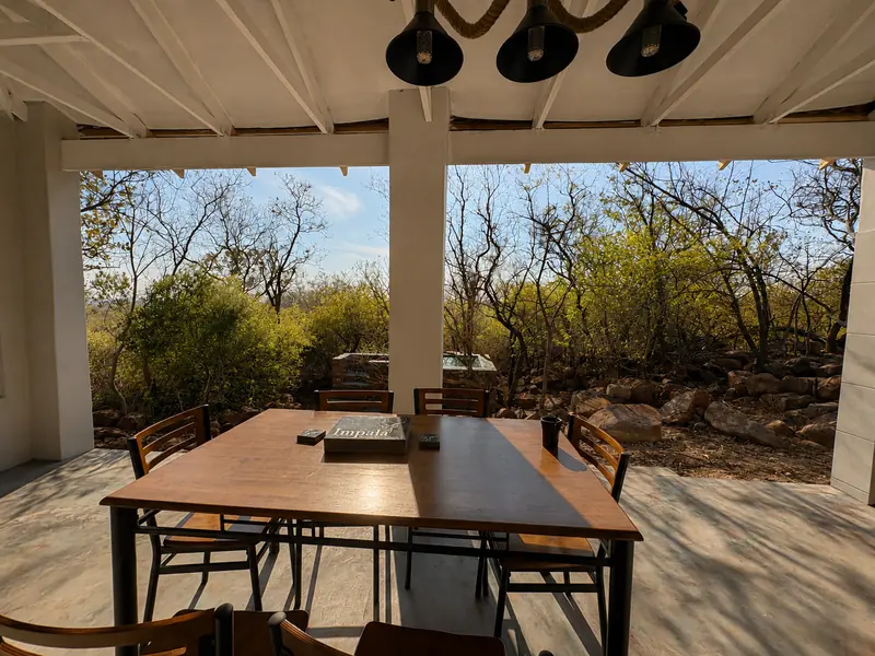 Dining table on the covered patio at the Rustic Retreat
