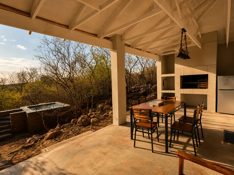 Covered patio at the Rustic Retreat looking into the bush